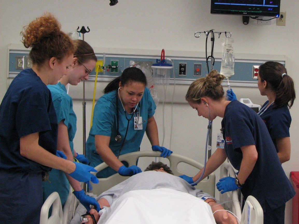 UVA Medical and Nursing students gather around bedside during sepsis simulation